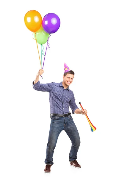 Male holding balloons and horn — Stock Photo, Image