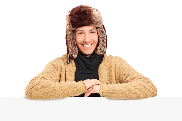 Young man with fur hat Royalty Free Stock Images