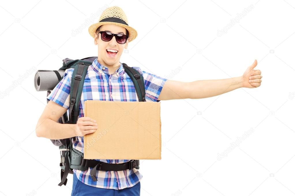 Male tourist with backpack hitchhiking 