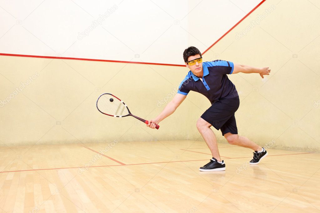 Squash player hiting ball — Stock Photo © ljsphotography #45880229