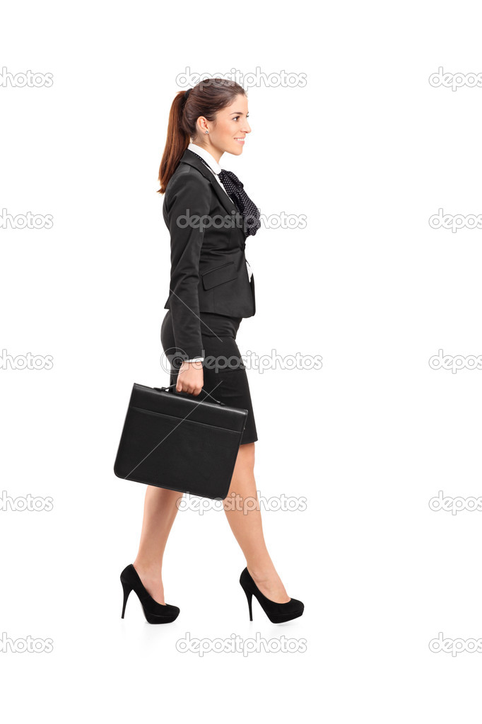 Businesswoman walking with briefcase