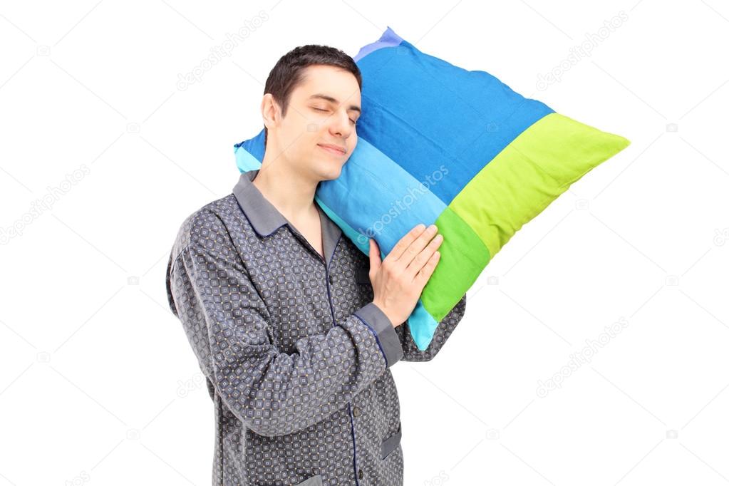 Guy holding pillow and sleeping Stock Photo by ©ljsphotography 45881743