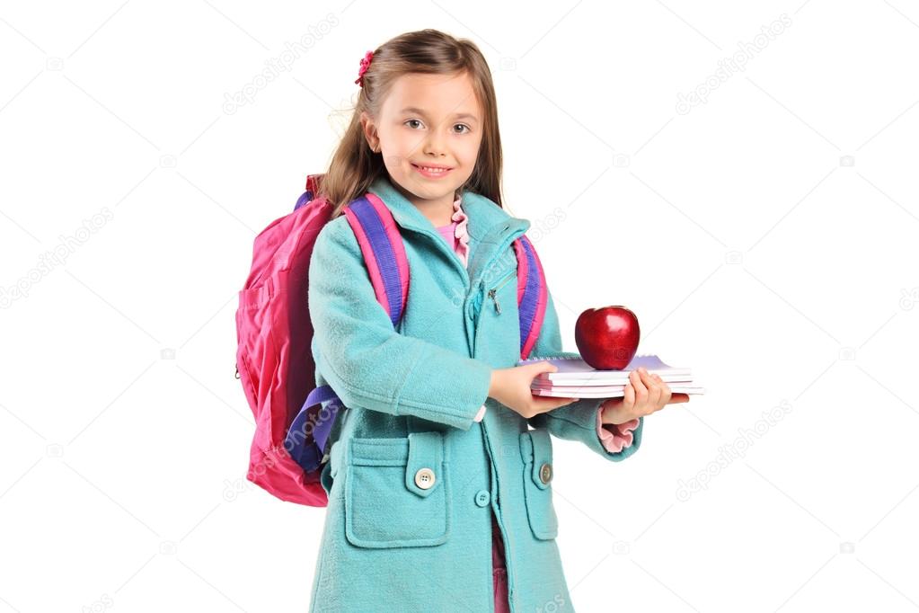 Children holding books and apple