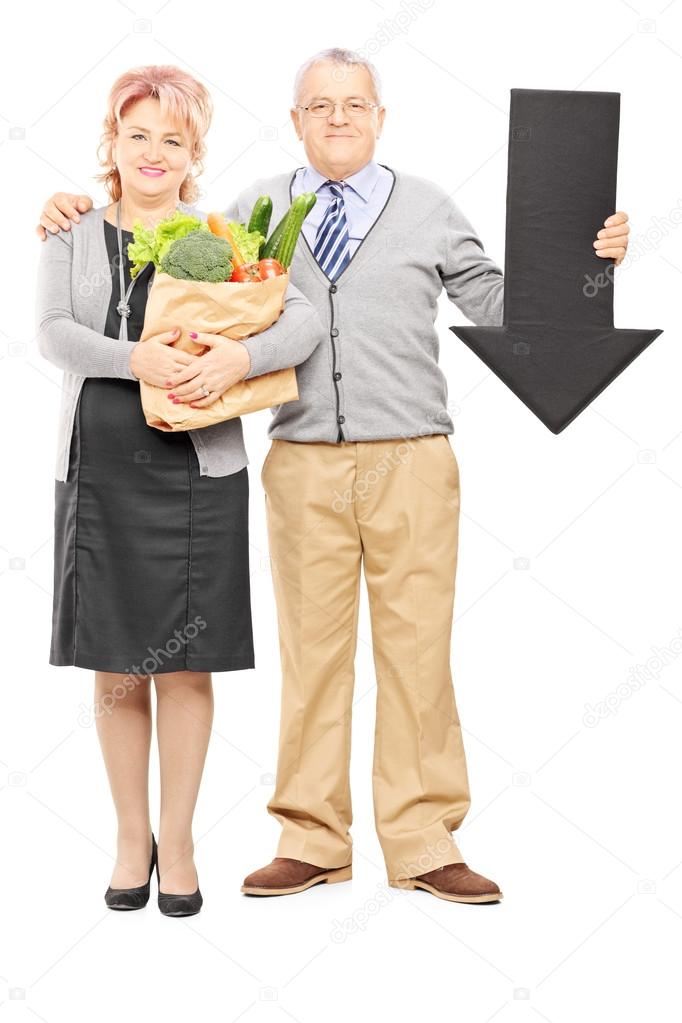Couple holding paper bag