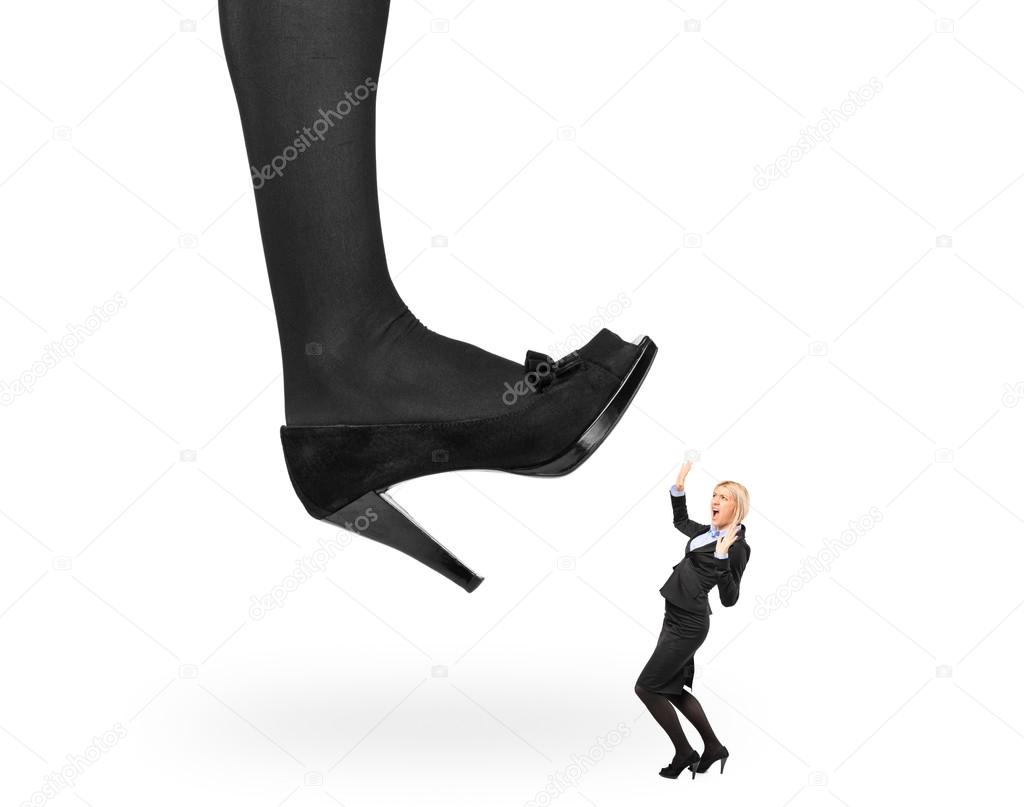 Woman shoe stepping on businesswoman