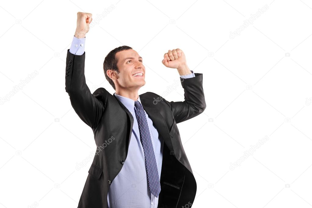 Happy businessman with raised hands