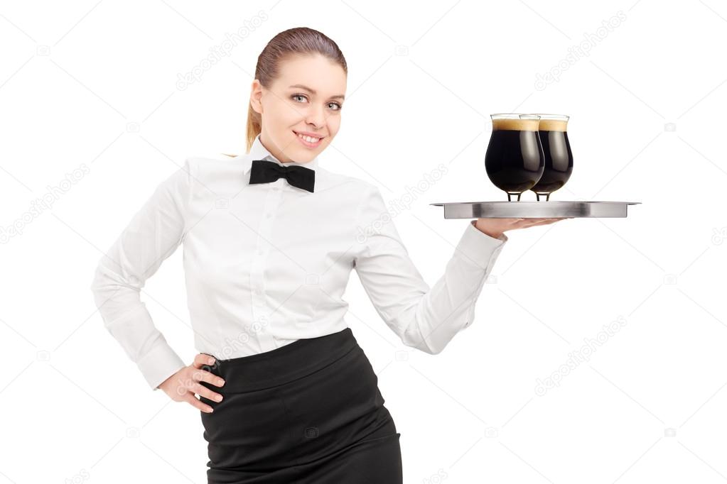 Waitress holding tray with beer