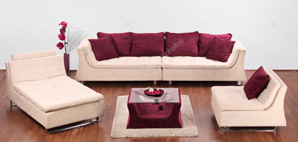 Furniture decorated with red pillows