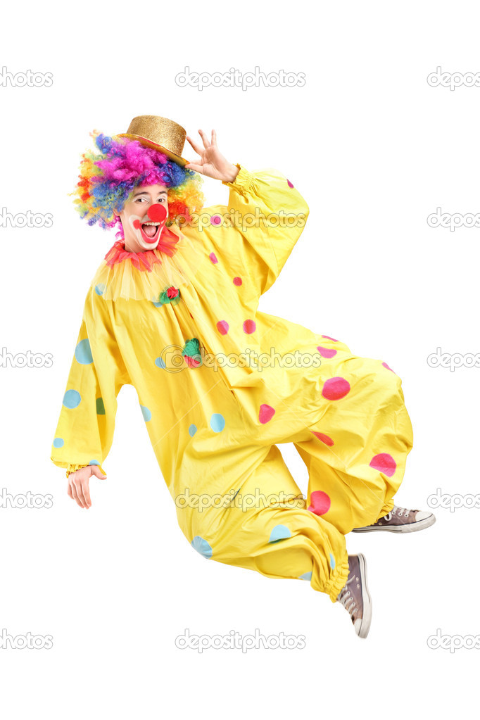 Male clown jumping and gesturing