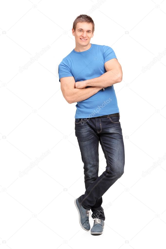 Young man leaning on wall