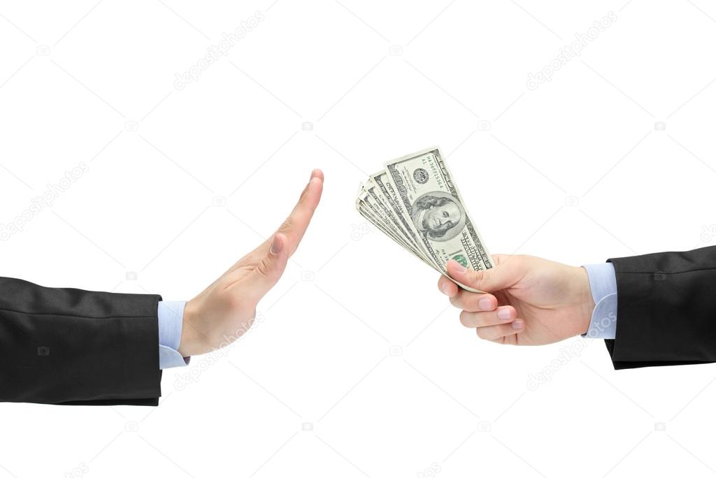 Businessman refusing offered bribe