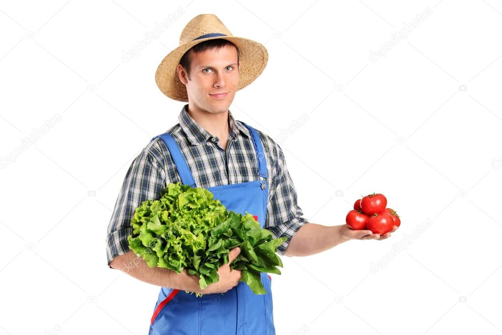 Male farmer holding vegetables