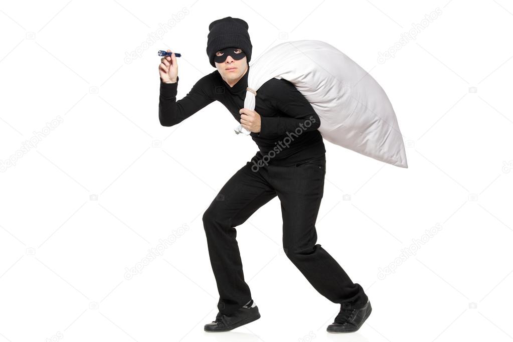 Thief with bag and flashlight