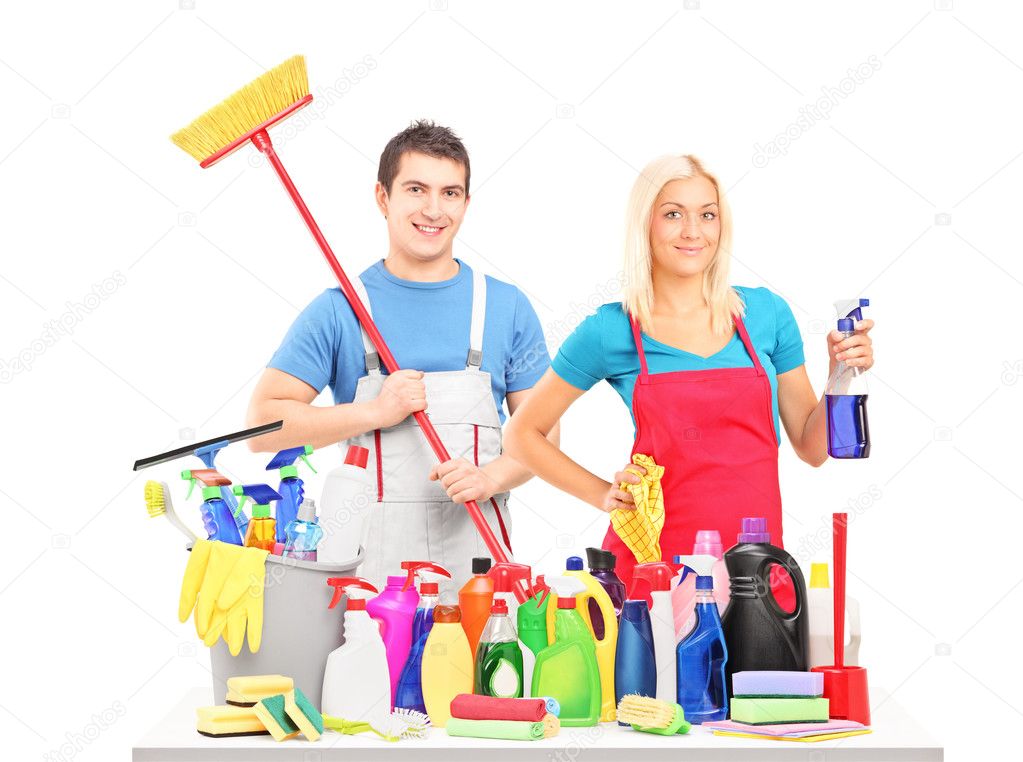 Male and female with cleaning supplies