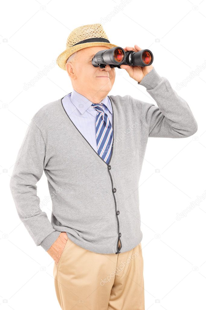 Senior gentleman looking through binoculars
