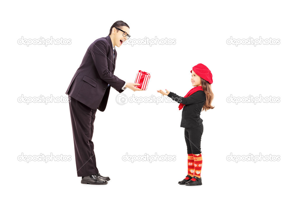 Man giving present to little girl