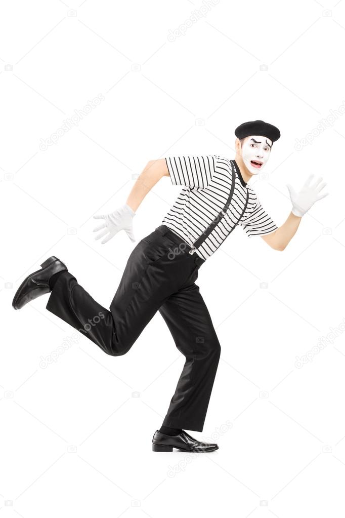 Scared male mime artist running away
