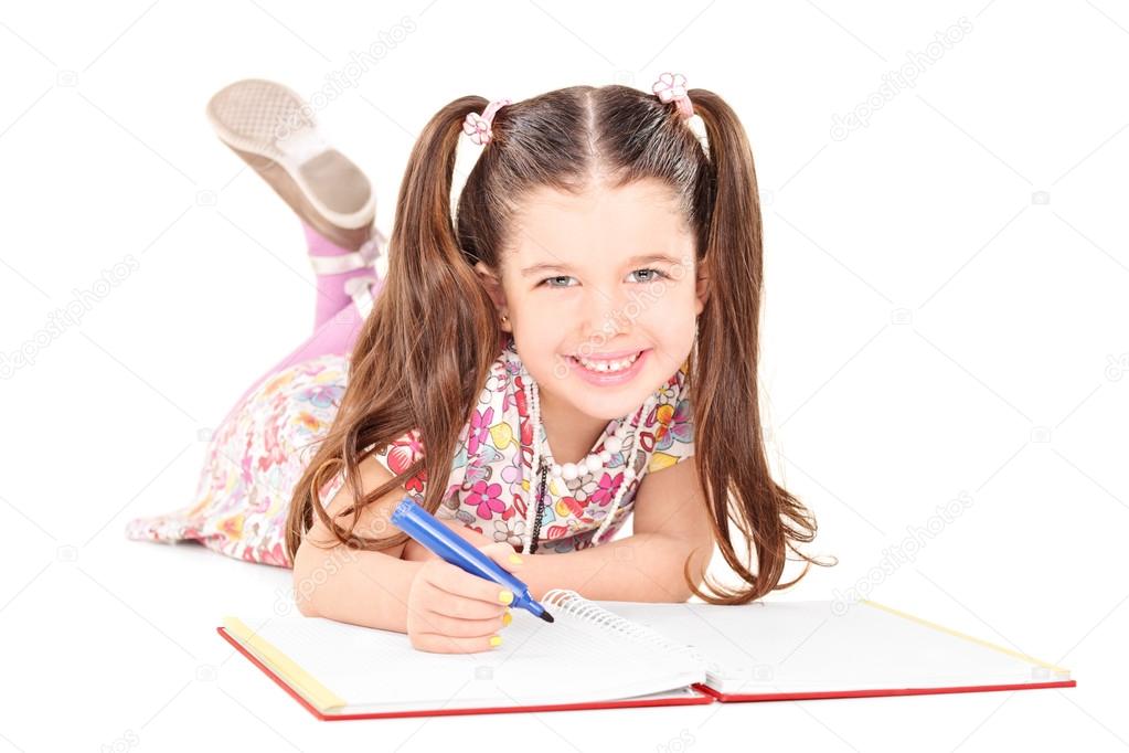 Girl drawing in notebook