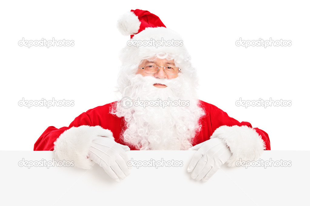 Santa Claus posing behind blank billboard