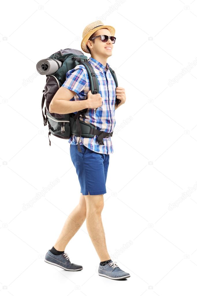 Male hiker with backpack walking