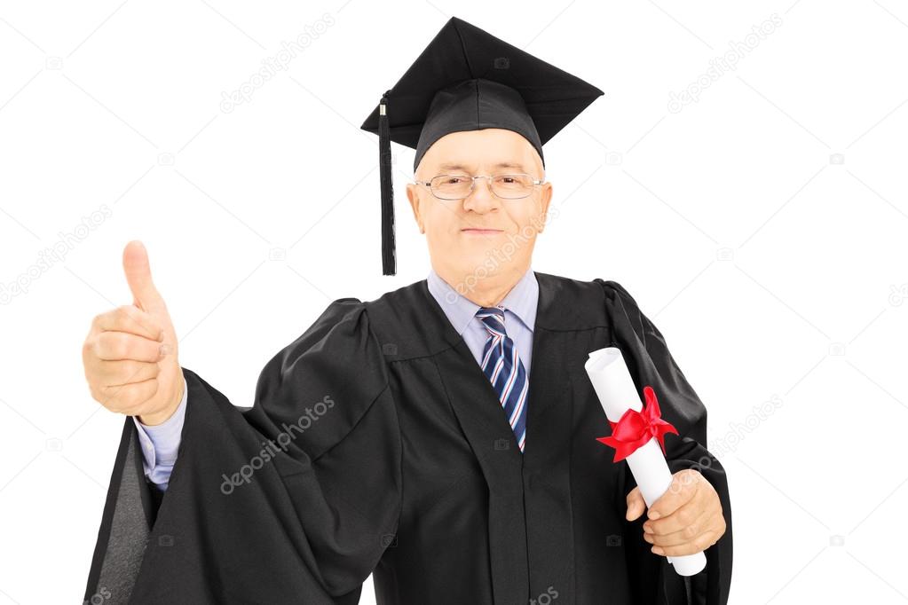 Man in graduation gown holding diploma