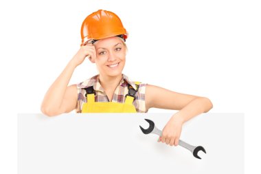 Female worker holding wrench clipart