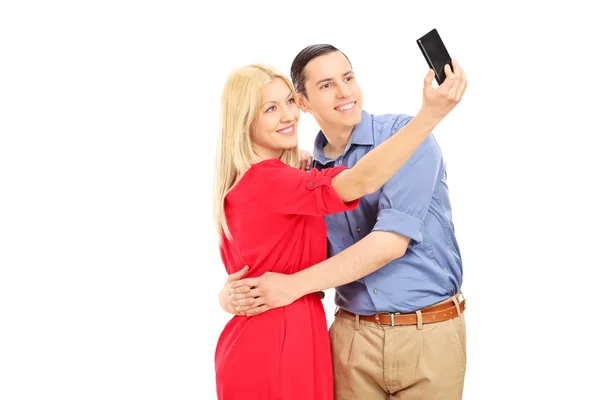 对年轻的夫妇采取拍照手机 — 图库照片