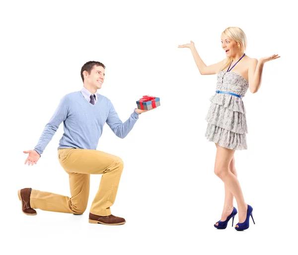 Male kneeling with gift — Stock Photo, Image