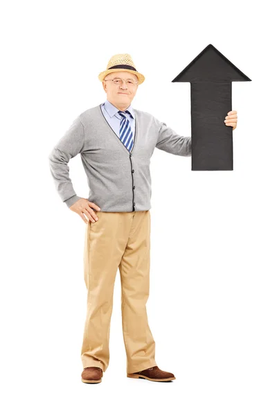 Hombre sosteniendo gran flecha negra —  Fotos de Stock