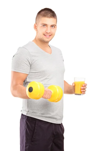 Man holding dumbbell and glass — Stock Photo, Image