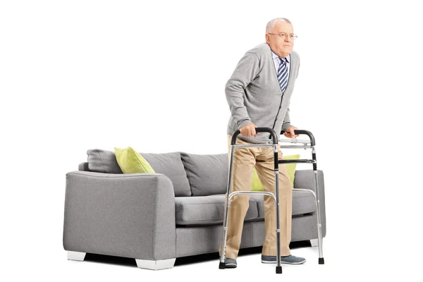 Senior gentleman walking with walker — Stock Photo, Image