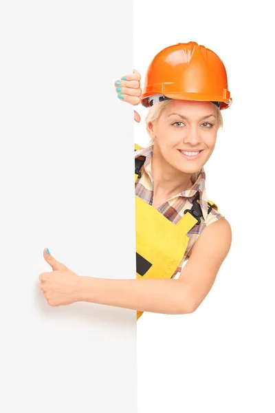 Female worker behind panel — Stock Photo, Image