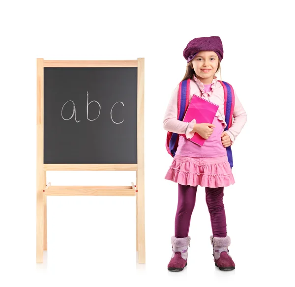 School kid next to school board — Stock Photo, Image