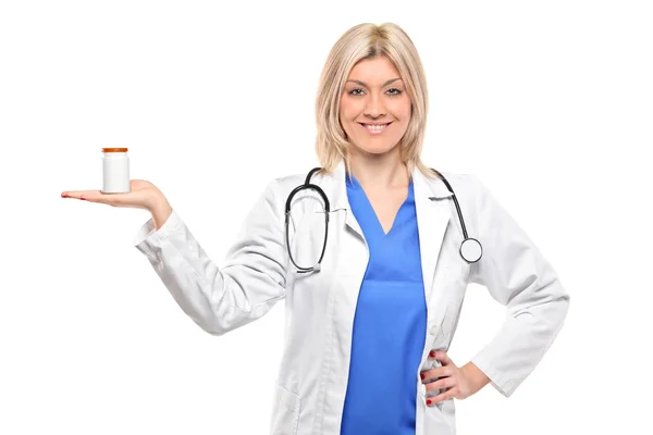 Female doctor holding bottle — Stock Photo, Image