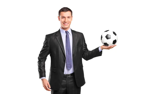 Businessman holding football — Stock Photo, Image