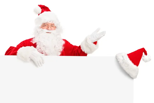 Weihnachtsmann hinter Reklametafel — Stockfoto