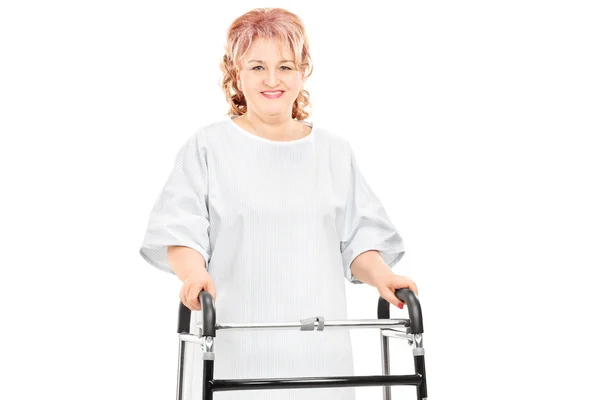 Female patient walking with walker — Stock Photo, Image