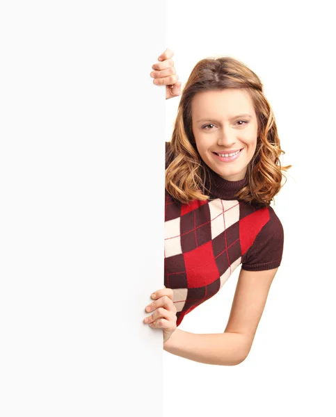 Girl posing behind white panel — Stock Photo, Image