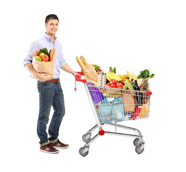 Homem segurando saco de compras — Fotografia de Stock