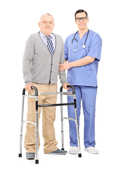 Senior gentleman with walker and doctor — Stock Photo, Image