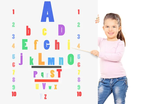 Child pointing on colorful eyesight test — Stock Photo, Image