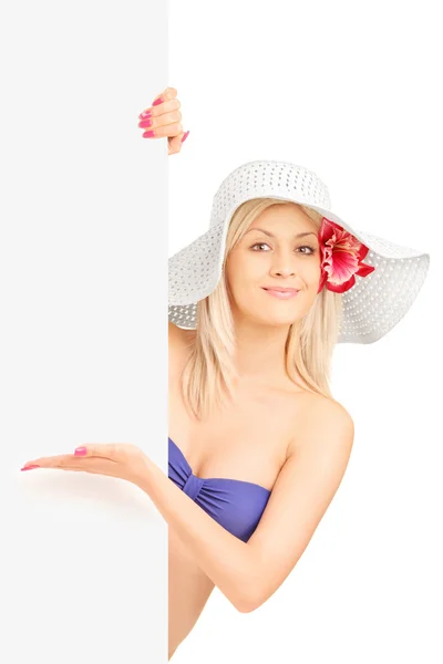 Woman gesturing on blank panel — Stock Photo, Image