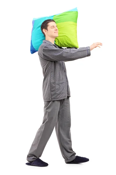 Man sleepwalking and holding pillow — Stock Photo, Image