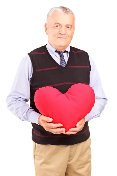 Starší gentleman drží červené srdce — Stock fotografie