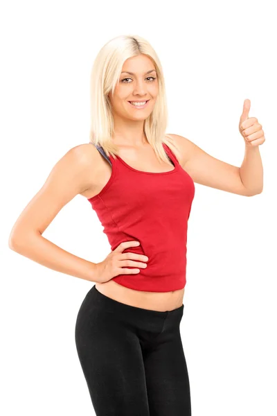 Fitness kvinna ger tummen upp — Stockfoto