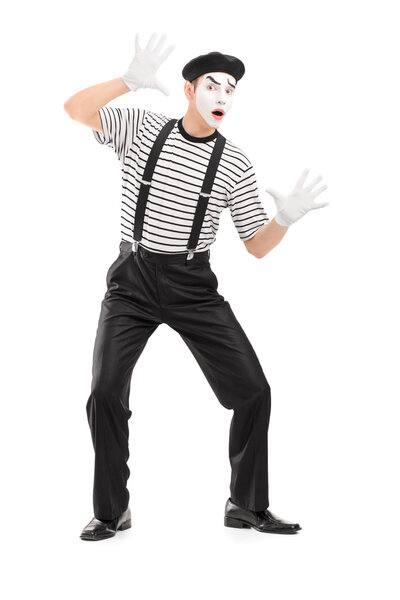 Male mime artist performing