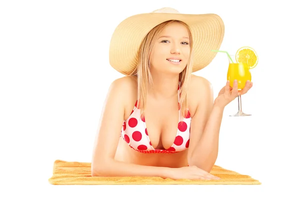 Female with lying on a beach towel — Stock Photo, Image