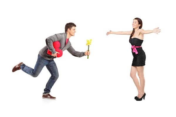 Man running with flowers and heart — Stock Photo, Image