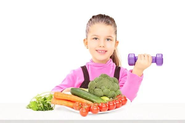 Child with plate of vegetables — Stock Photo, Image