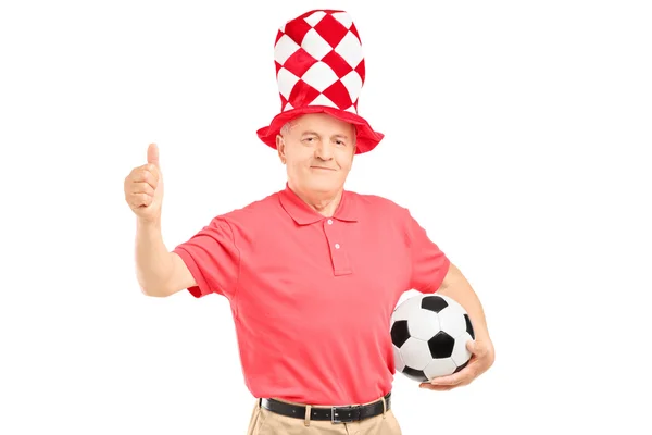 Mature fan holding soccer ball — Stock Photo, Image